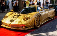 Pagani Zonda art car adorned with 100,000 coins and featuring Lionel Messi's face on the hood, showcased at Miami Concours Art Week